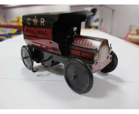 A 1930's Tinplate Clockwork Van by Wells, black/red 'G R Royal Mail'. No seat or driver. Overall good plus condition. Solid w