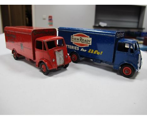 Two Original Dinky Guy Vans #514 'Slumberland', first type red cab/chassis/back and hubs, spare wheel. The other #918 'Ever R