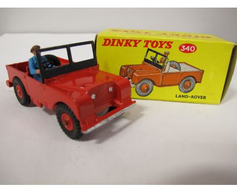 A Boxed Original Dinky #340 Land Rover, red body, red interior, red plastic hubs, blue plastic driver. Model very good plus, 