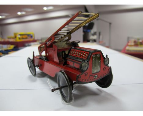 A 1930's Tinplate Clockwork Fire Engine, probably by Wells but not marked. No driver, but slots in seat cut. Some signs of we