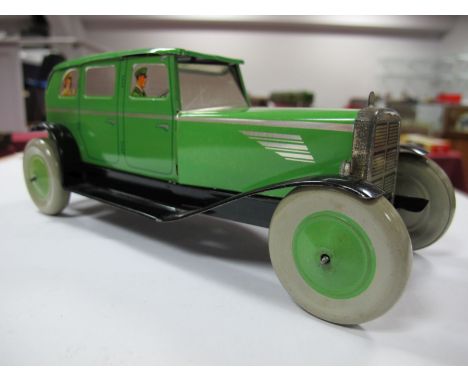 A 1946 Tinplate Clockwork Saloon Car by Chad Valley, finished in green with passengers to windows. Very good plus. Unboxed.