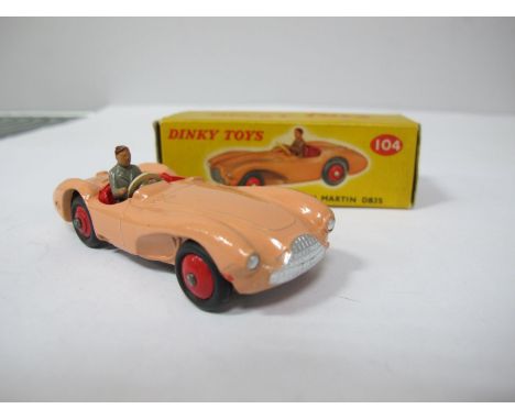 A Boxed Original Dinky #104 Aston Martin DB35 Touring Finish, salmon pink body, red interior and hubs, grey driver, black glo