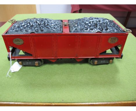 A 1930's Lionel American Standard Gauge Eight Wheel Coal Hopper No. 516, in red.