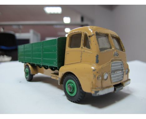 An Original Dinky #431 Guy Warrior Four Ton Lorry, light tan cab and chassis, dark green back, mid green hubs, spare wheel an