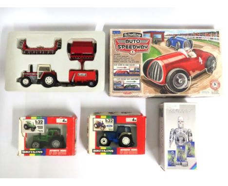 A boxed tin plate Schylling Auto Speedway set, Two Britains diecast tractors, faults to boxes, one other part boxed tractor &