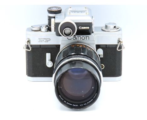 A Canon FP 35mm film camera with manual along with a Canon FL 135mm lens with leather lens case & Canon FP meter, serial no. 