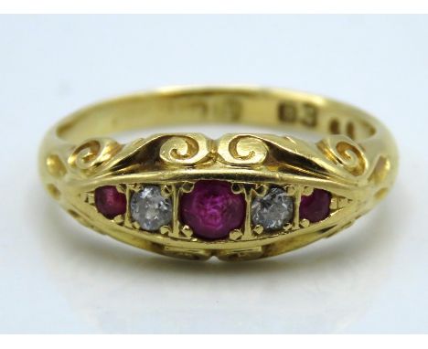 An antique 18ct gold ring with carved decor set with diamond & ruby, 4g, size M
