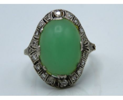 A white metal clip shank ring set with jade & diamond, 5.9g, size O