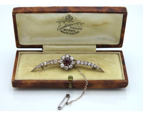 An antique bi-metal brooch set with central ruby of 4.5mm diameter & approx. 1.13ct of diamond, 5.2g, 57mm wide