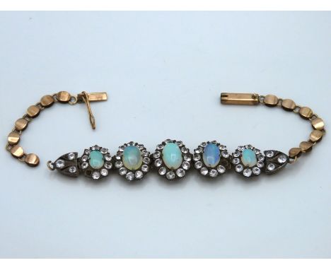 A yellow metal bracelet, tests electronically as 9ct gold, set with opal & paste, 160mm long, 9g, a/f