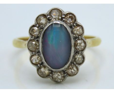 An 18ct gold ring with platinum set opal doublet & approx. 0.6ct of diamonds, ring head 16mm x 12.75mm, 3.7g, size O