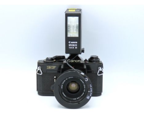 A Canon EF 35mm film camera with Canon FD 35mm lens & Canon Speedlite 133D flash with manual & case, serial no. 303338