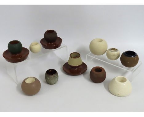 A collection of eleven ceramic match strikes & vesta holders including Lovatt & Carlton Ware