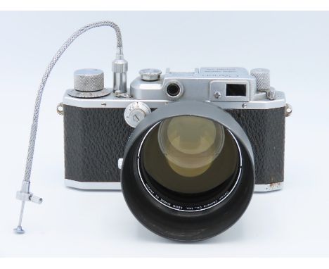 A Canon Rangefinder 35mm film camera with a Canon EX 95mm lens with leather lens case, serial no. 26198