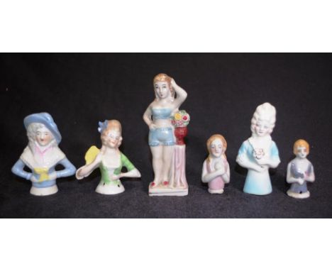 Group five various ceramic half dolls (height 8cm approx, tallest); together with a bathing beauty standing ceramic figure, (