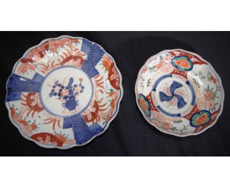 Two various Japanese 'Imari' ceramic dishes each with traditional iron red and blue decoration, (diameter 15.5cm, and 21cm ap