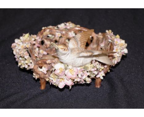Antique German porcelain basket form bowl decorated with applied bird figure and multi-form blossoms, (some small losses), on