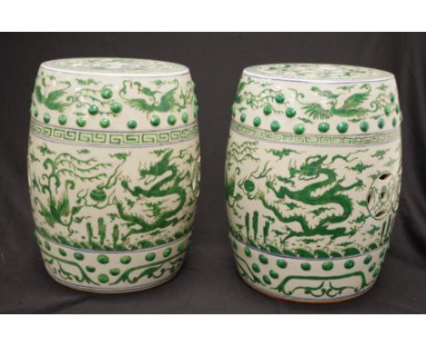 Good pair Chinese ceramic  drum form stools painted  green bird and blossom decoration, (height 36cm approx, each).