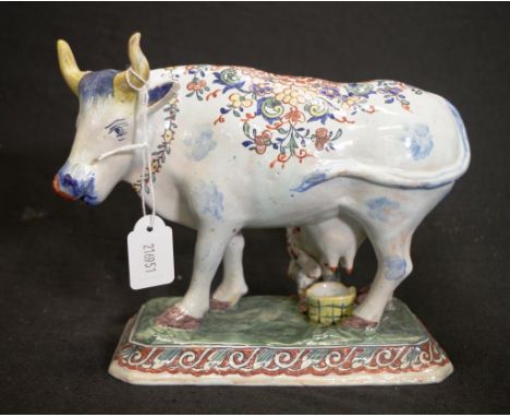 Large antique hand painted ceramic cow figure painted blossom decoration to standing cow figure, on green glaze decorated  ba