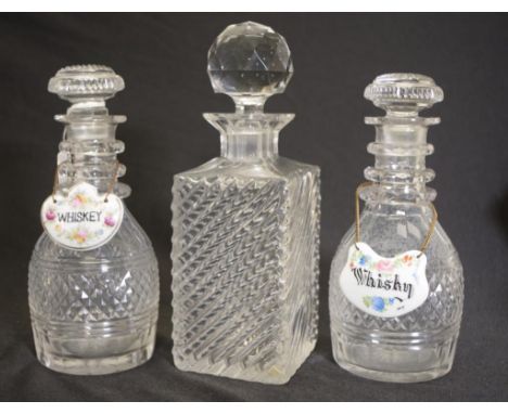 Pair antique ring necked crystal decanters (height 20cm approx, each), each with ceramic 'Whisky,' decanter label; together w