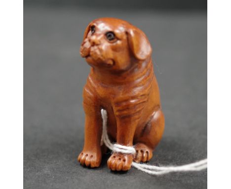 Japanese boxwood netsuke carving of a dog signed to base, height 5cm approx