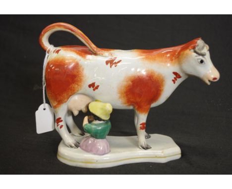 Antique painted ceramic cow figure creamer brown painted standing cow figure jug, with seated milkmaid figure to side, (lid u