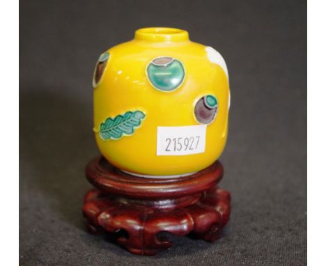 Chinese yellow ceramic brush washer &amp; stand decorated ceramic brush washer, (height 6cm approx), on carved wood stand.