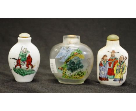 Two various hand painted ceramic snuff bottles each with painted figural decoration, and greenstone stopper, character marks 