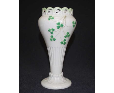 Belleek decorated ceramic table vase shamrock decorated, with pierced upper rim, and footed base, black mark to base, (height