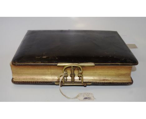 Victorian leather bound photograph album enclosing many original portrait photographs from the period, leather bound, with br
