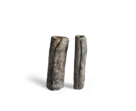  Two Roman lead curse tablets Circa 150-300 A.D.In their original rolled state, 7.6cm and 7cm long, 0.15-0.3cm thick; weight 