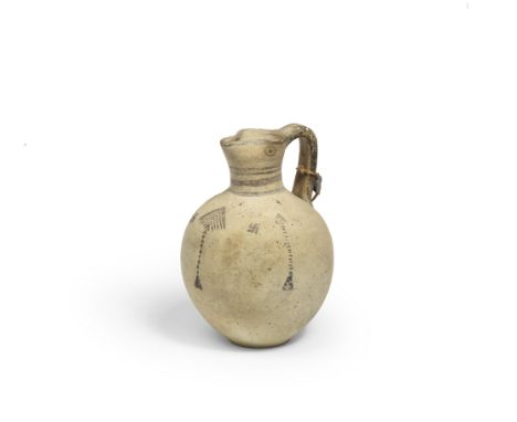  A Cypriot bichrome ware pottery jug Iron Age, cira 1050-900 B.C.With a dot and circle bird's eye to either side of the trefo
