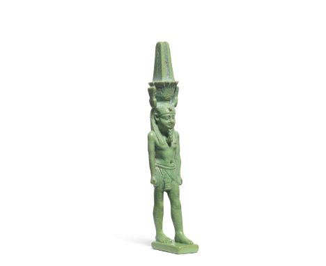  A large Egyptian turquoise glazed composition amulet of Nefertum Late Period, circa 664-332 B.C.Nefertum depicted striding f