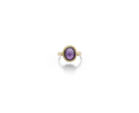  A Roman amethyst intaglio Circa 1st-2nd Century A.D.Carved with a nude male figure, likely a god, standing leaning on a colu
