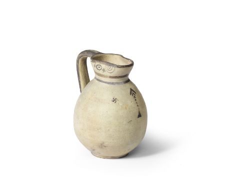  A Cypriot bichrome ware pottery jug Iron Age, circa 1050-900 B.C.Decorated below the trefoil lip with bird's eye, swastika a