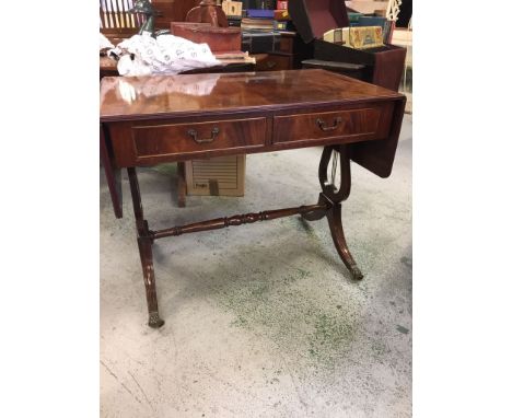 A drop leaf sofa table