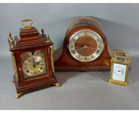 A brass cased carriage clock, together with two mantel clocks 