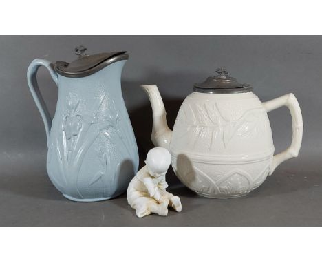 A Victorian salt glazed teapot together with a similar jug and a bisque figure 