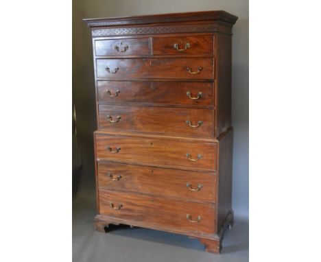 A 19th Century mahogany chest on chest, the moulded cornice above two short and six long drawers raised upon bracket feet, 11