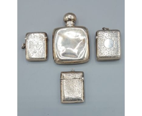 A Chester silver engraved Vesta case together with two other silver Vesta cases and a Chester silver small flask, 4ozs 