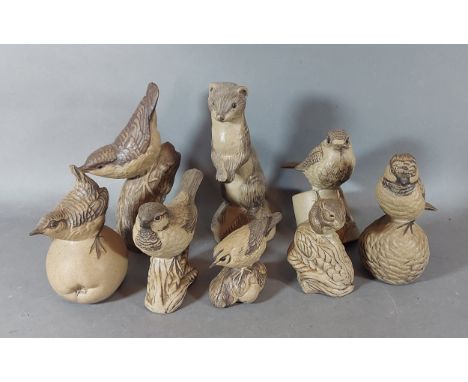 A Poole pottery model of an Otter together with six Poole pottery models of birds and a model of a field mouse 