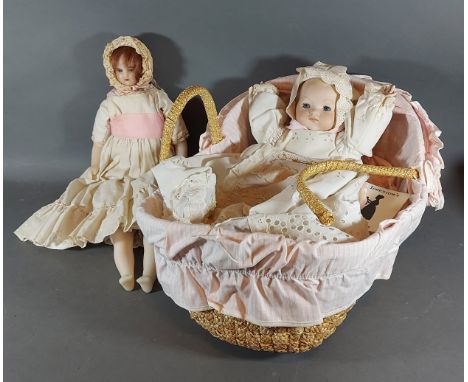 An Armand Marseilles bisque headed doll together with a wax doll 