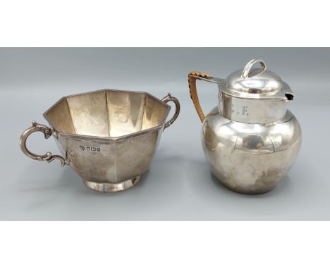 A Sheffield silver two handled sucrier together with a Sheffield silver hot water pot, 12ozs 