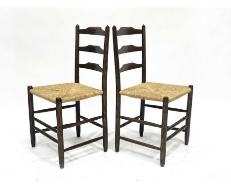 Lawrence Neal after Ernest Gimson, a pair of Cotswold School Clisset ladder back chairs, circa 1960s, with rush seats, three 