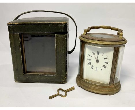 A French carriage clock, early 20th Century, oval brass corniche case with visible escapement, white enamel dial with Roman n
