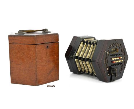 Lachenal &amp; Co, London, a concertina squeeze box, Serial No.43094, fretwork rosewood ends, forty-eight bone buttons, maker