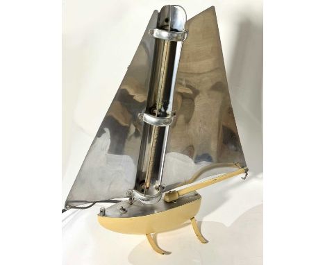 A 1930's Art Deco heater styled as a sailboat by Bunting Electric Company, the sails with a mirror finish, the boat itself in