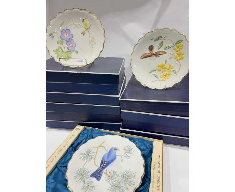 A full set of twelve Dorothy Doughty for Royal Worcester bird plates (1972 - 1983) in original packaging with booklet (2 tray
