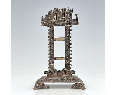 A William IV silver 'castle top' desk thermometer stand, the upright rectangular frame with dual bracket supports, designed t