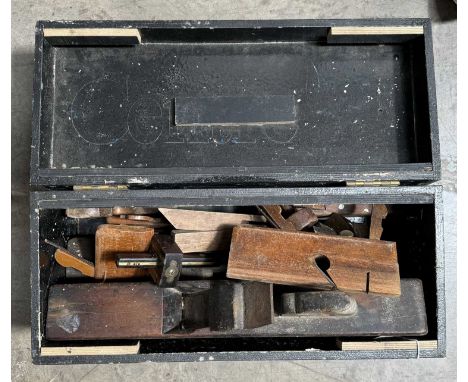 A toolbox containing late 19th and early 20th century carpentry/woodworking tools including brass inlaid scribe gauges by Mar